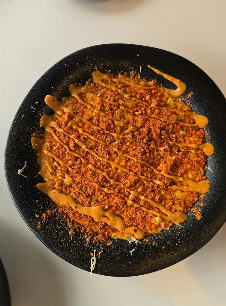 Main dish served on a black plate