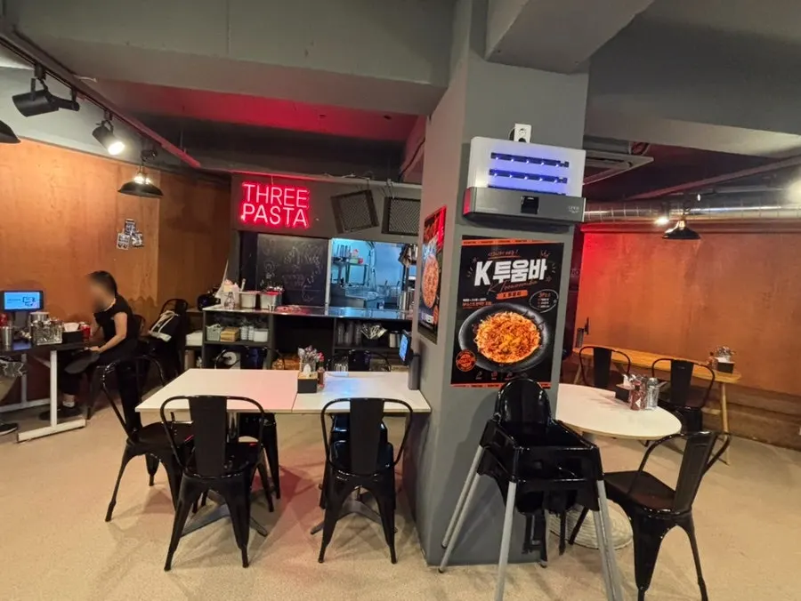 Mid-century styled dining hall at Three Pasta