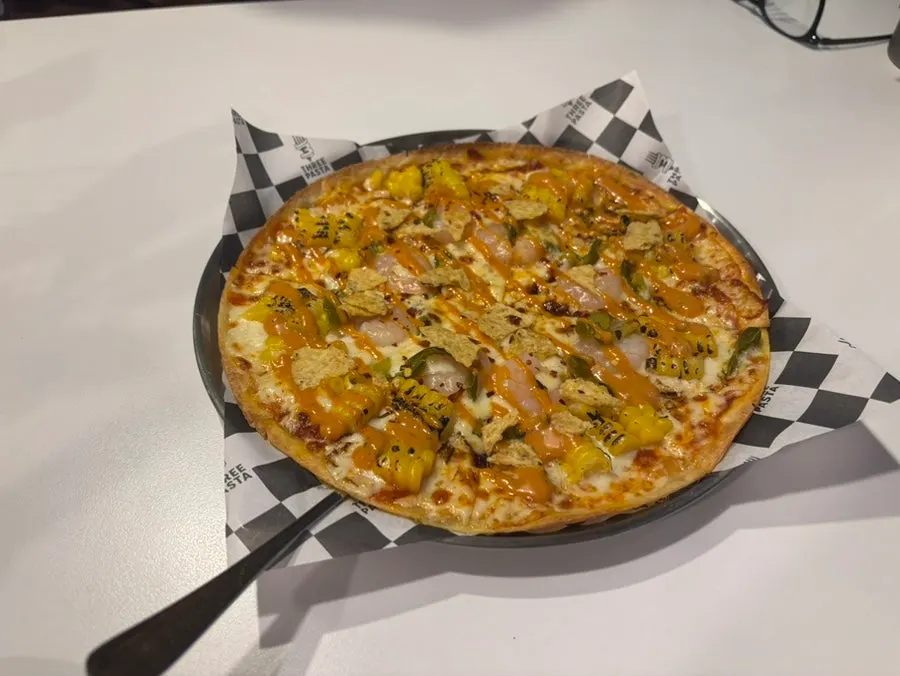 Chipotle shrimp thin-crust pizza topped with nachos