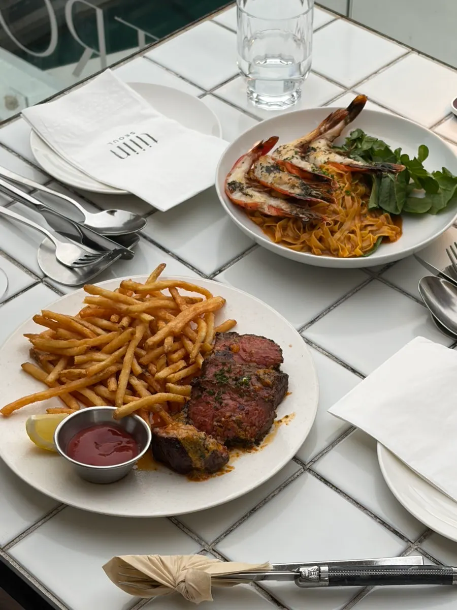 Two plates of Teen Seoul's Western dishes on the table