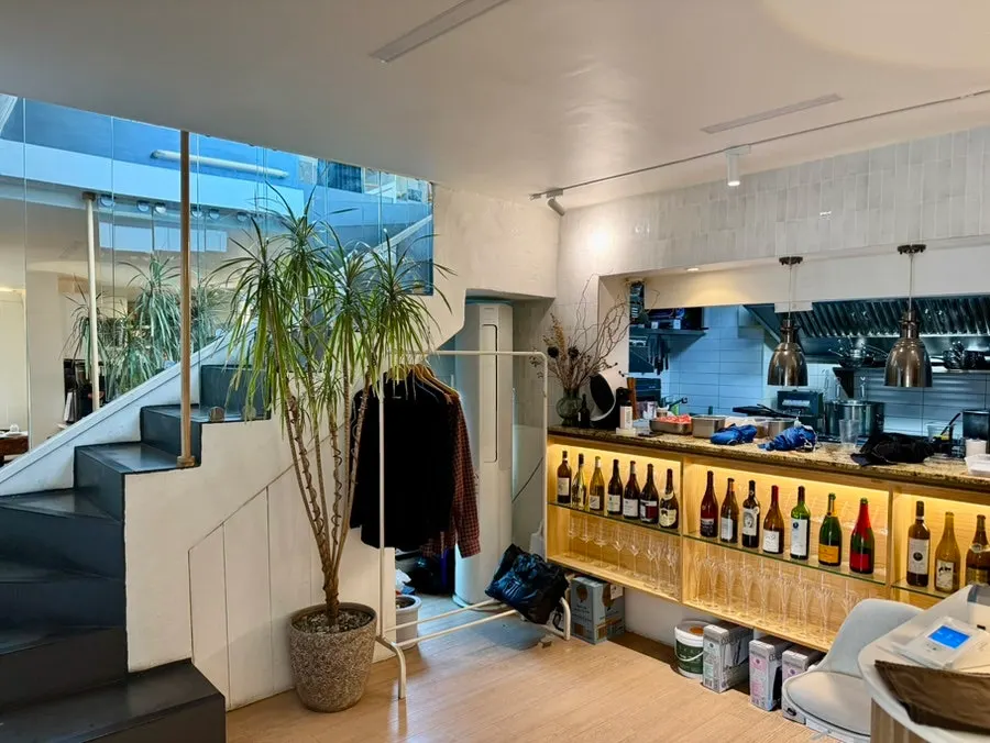 Open kitchen and bottles inside Teen Seoul's 1st floor