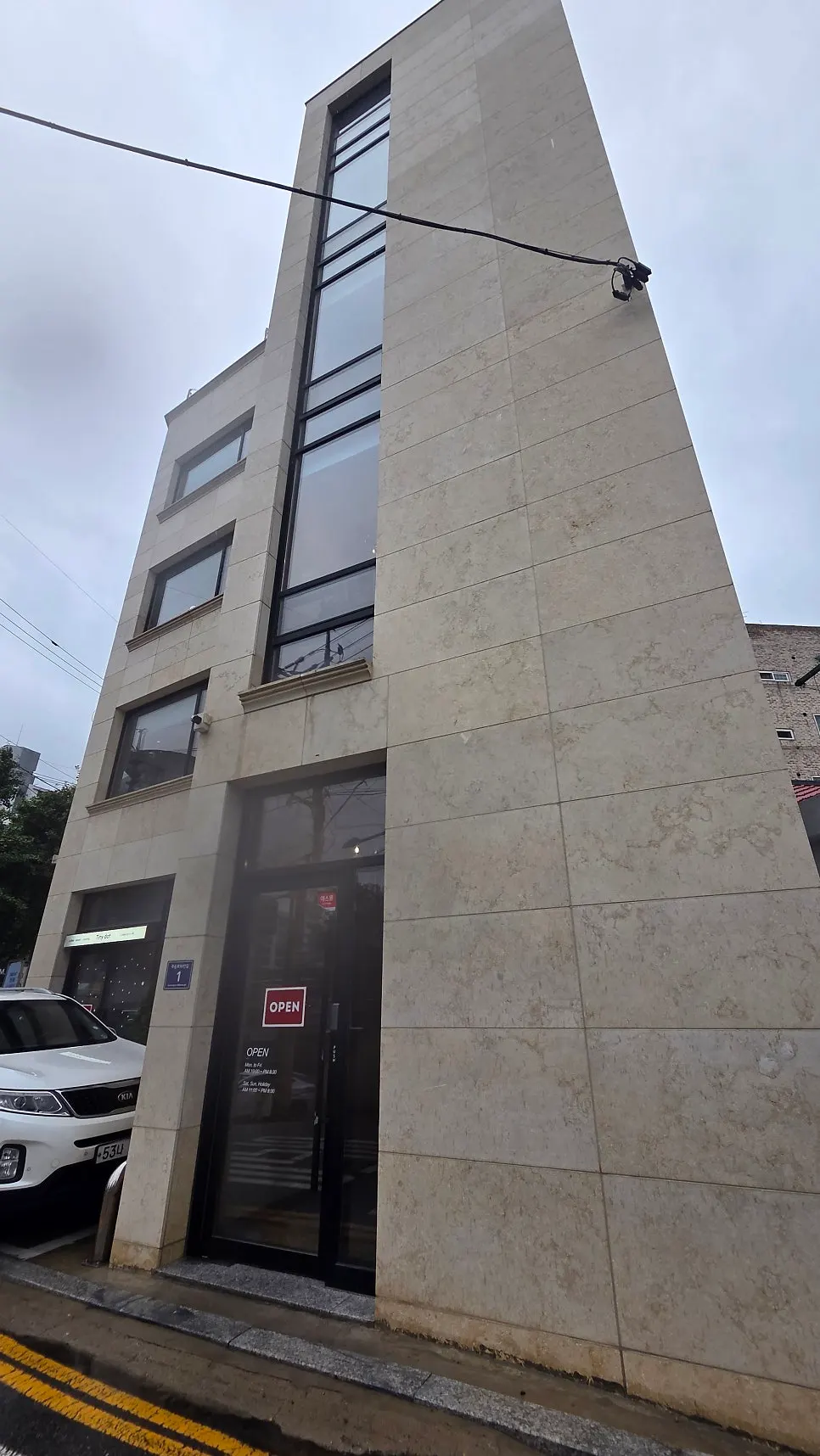 Exterior of Tiny Dot, a café occupying the entire building