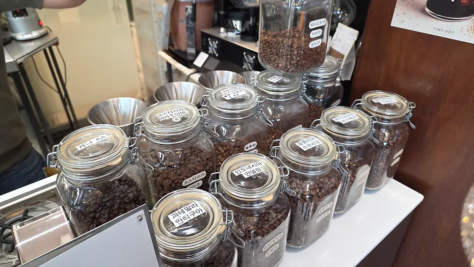 Drip bags and coffee beans displayed at Tiny Dot