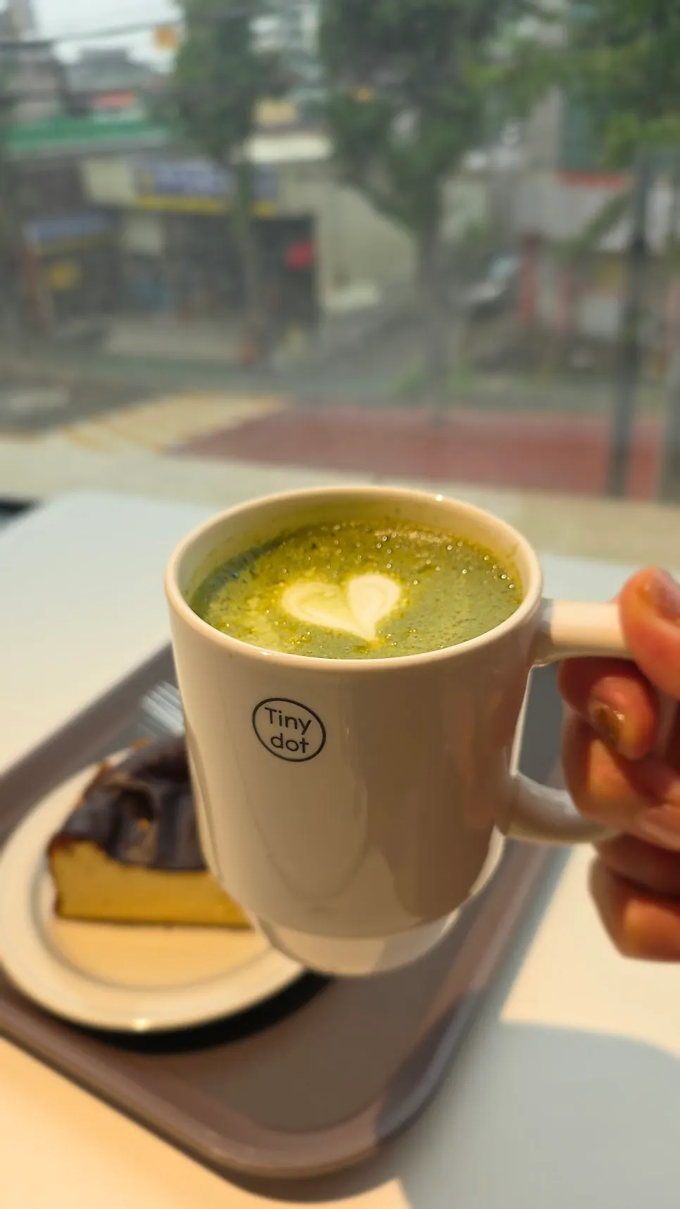 A cup of stone-mill matcha latte made with Hadong matcha
