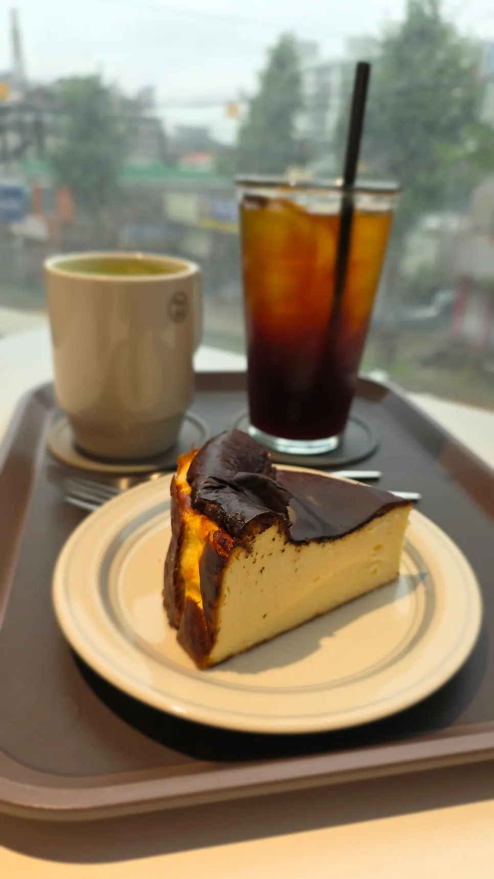 A slice of Tiny Dot's Basque cheesecake