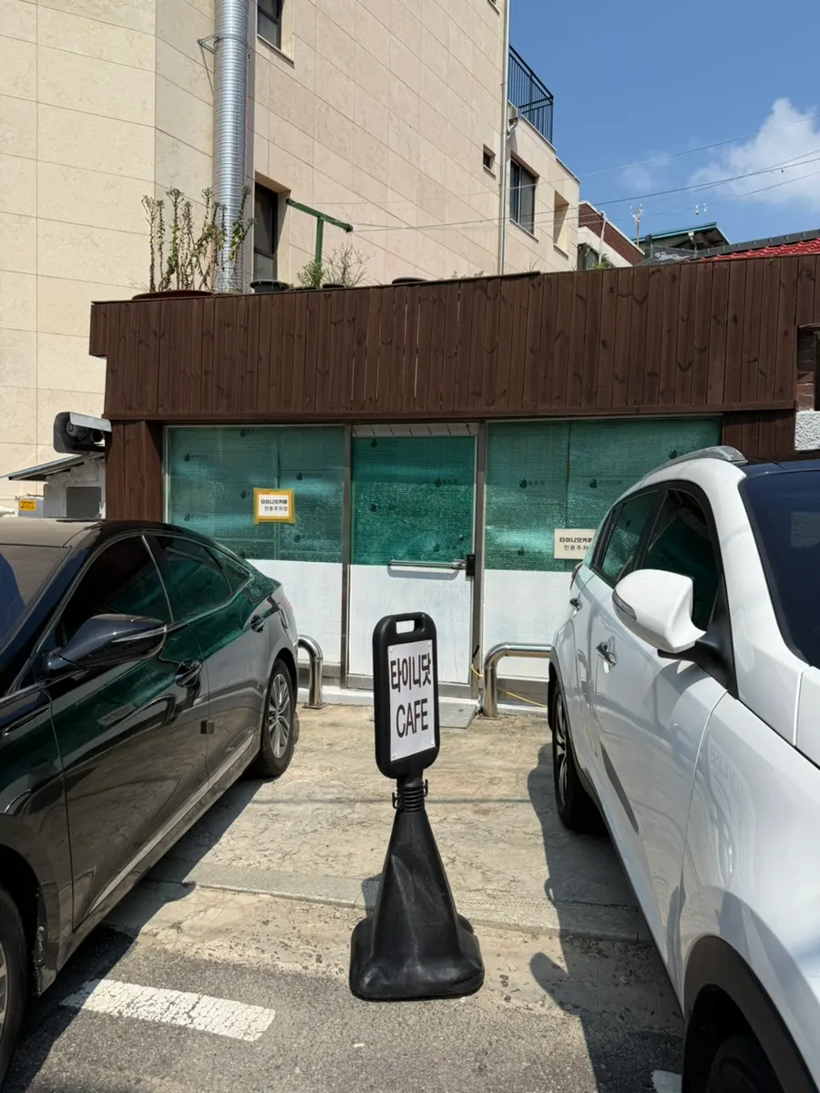 Dedicated parking area behind Tiny Dot's building