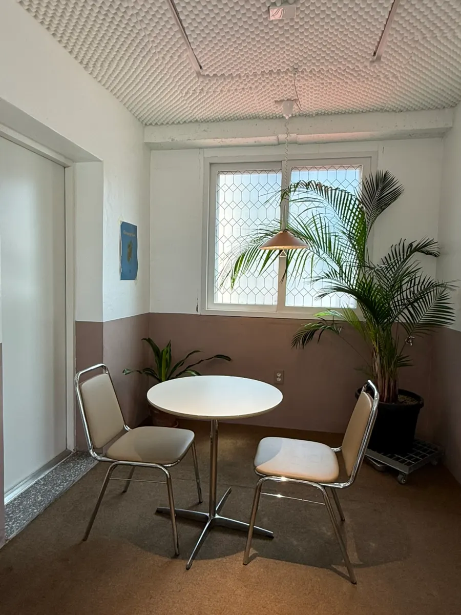 Wide table seating facing the window