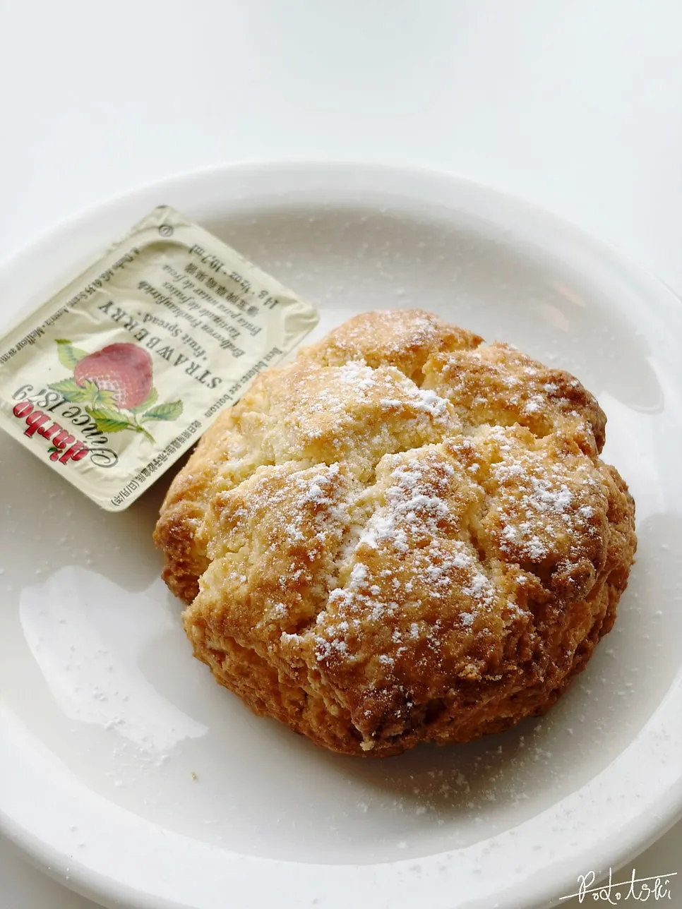 Table setting with ordered drinks and scone at Tiny Dot