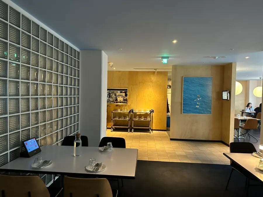 Widely spaced tables and framed wall art