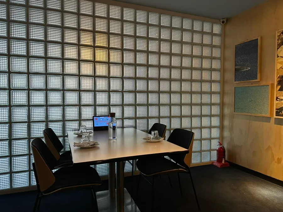 Large framed artwork hanging on the restaurant wall