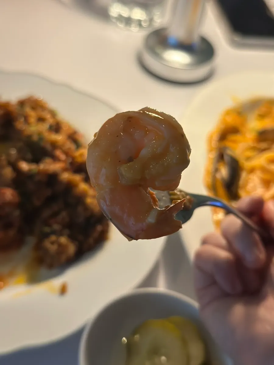 Rosé pasta noodles twirled up on a fork