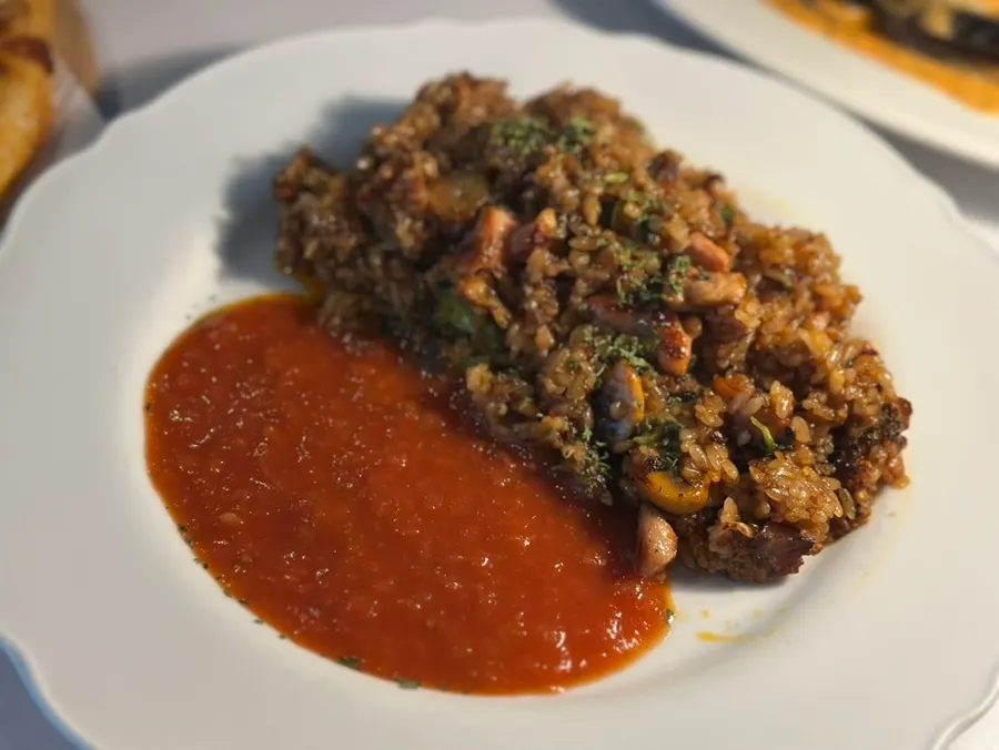Chicken pilaf topped with chicken thigh meat