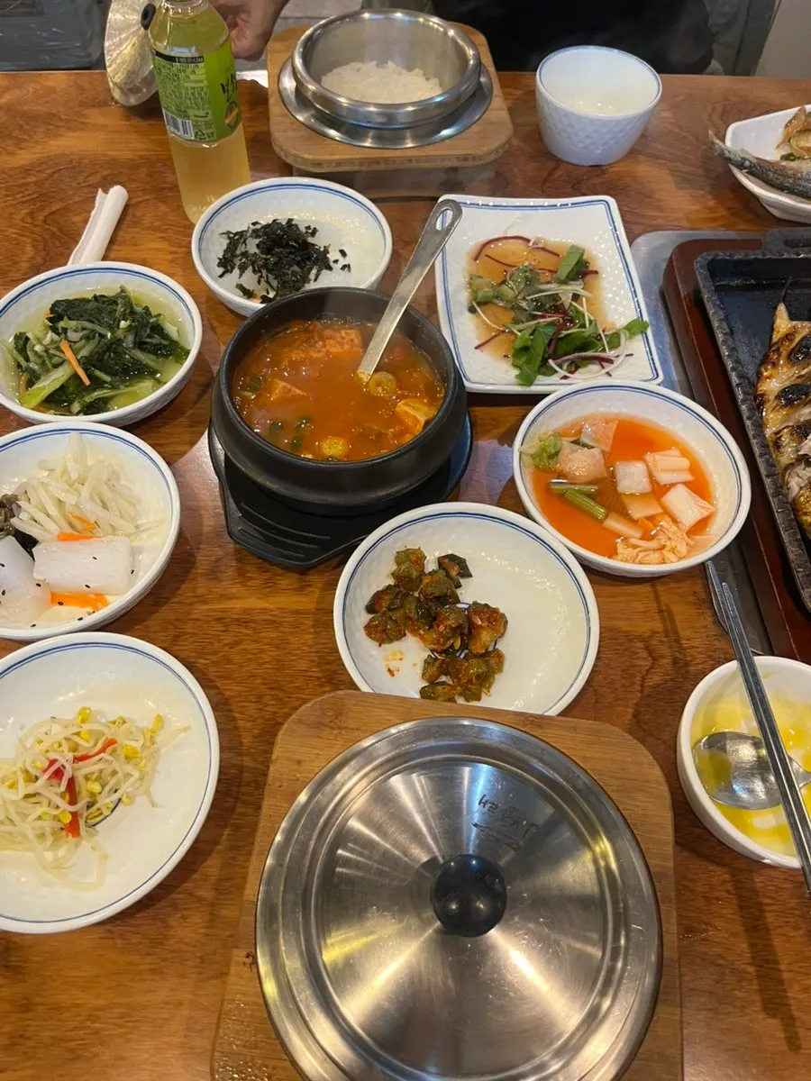 A piece of fish placed on top of hotpot rice