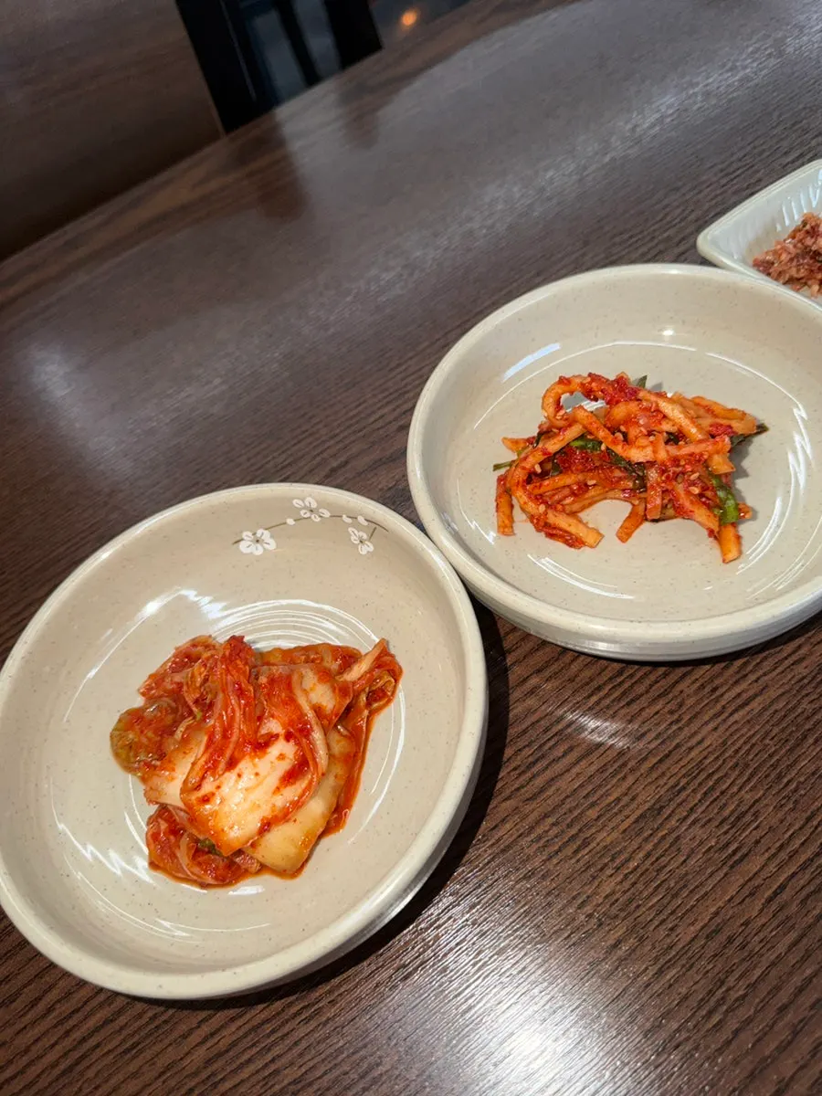 A full spread of banchan at Todamok