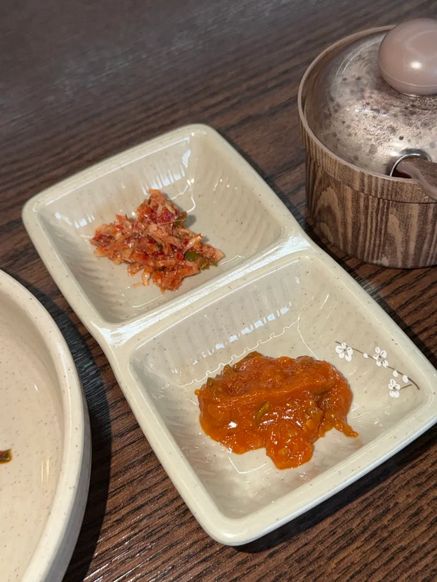 Kimchi served alongside kalguksu at Todamok