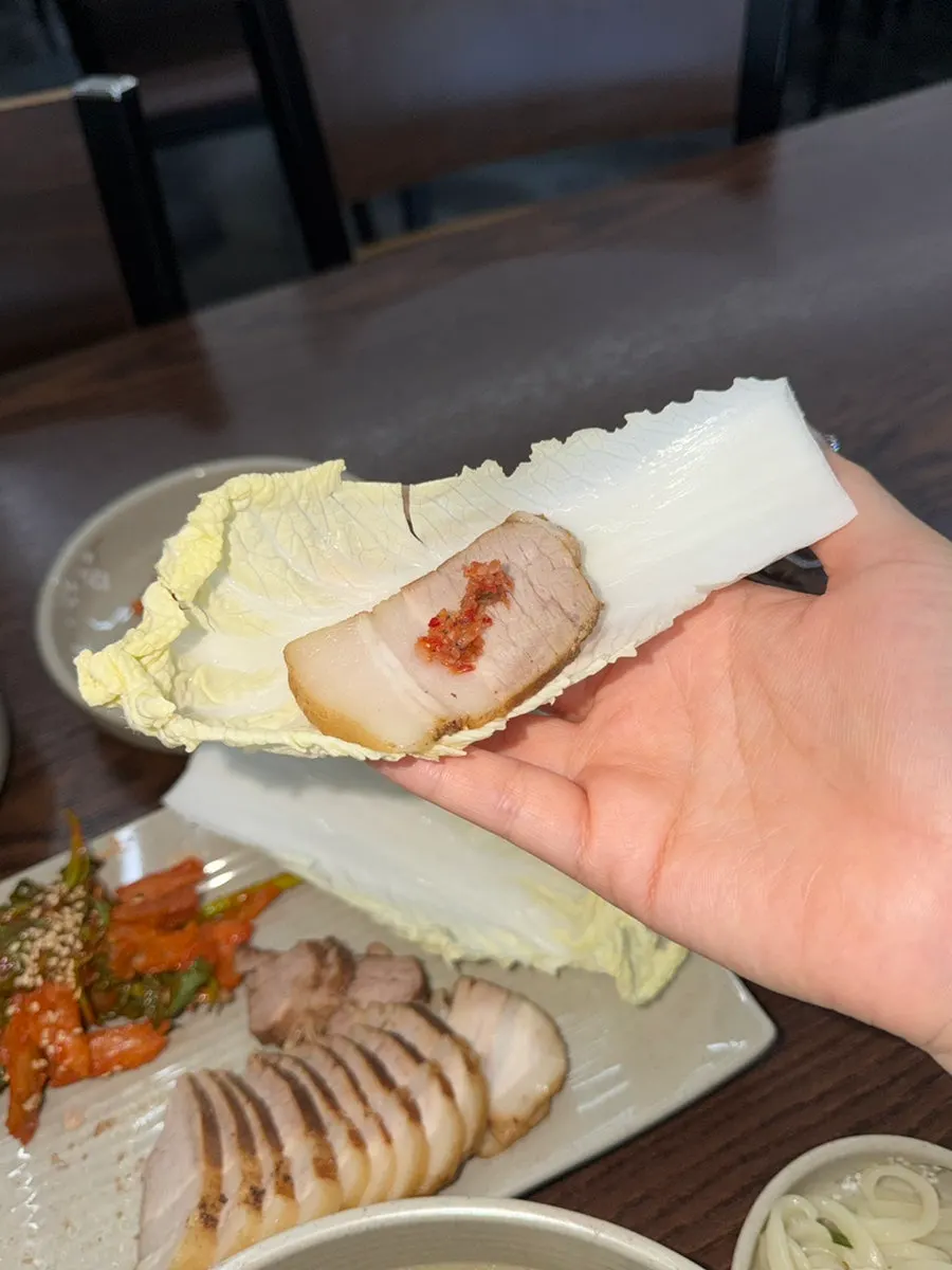 Bossam eaten together with kimchi at Todamok