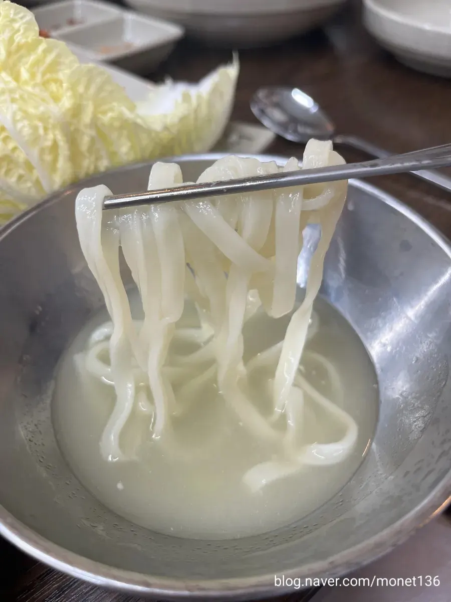 Two-person set spread with bossam, roe-and-milt kalguksu, and chicken kalguksu