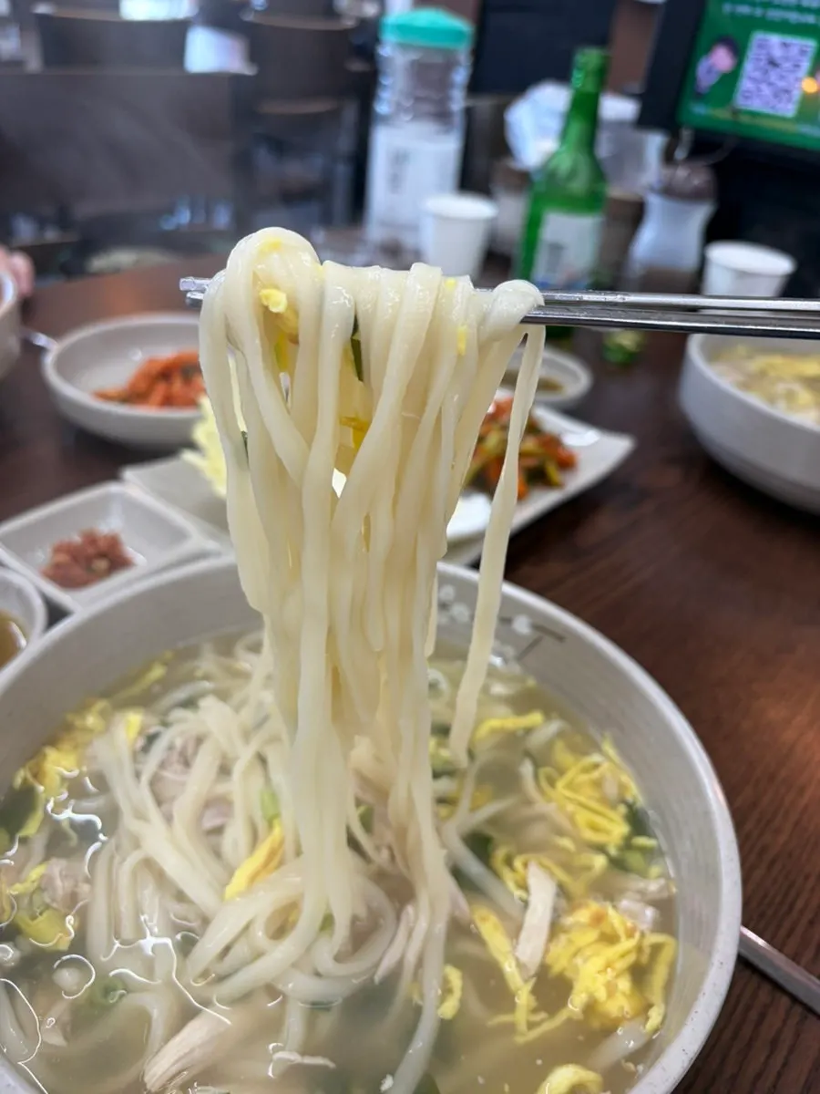 Todamok's chicken kalguksu topped with egg garnish