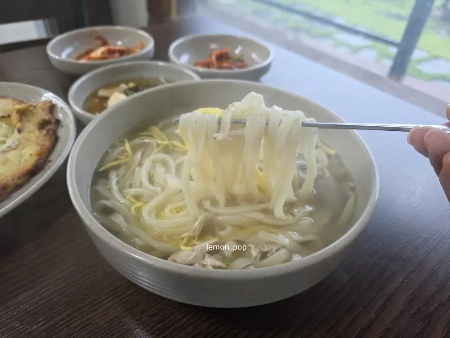 Close-up of the chicken kalguksu's milky broth
