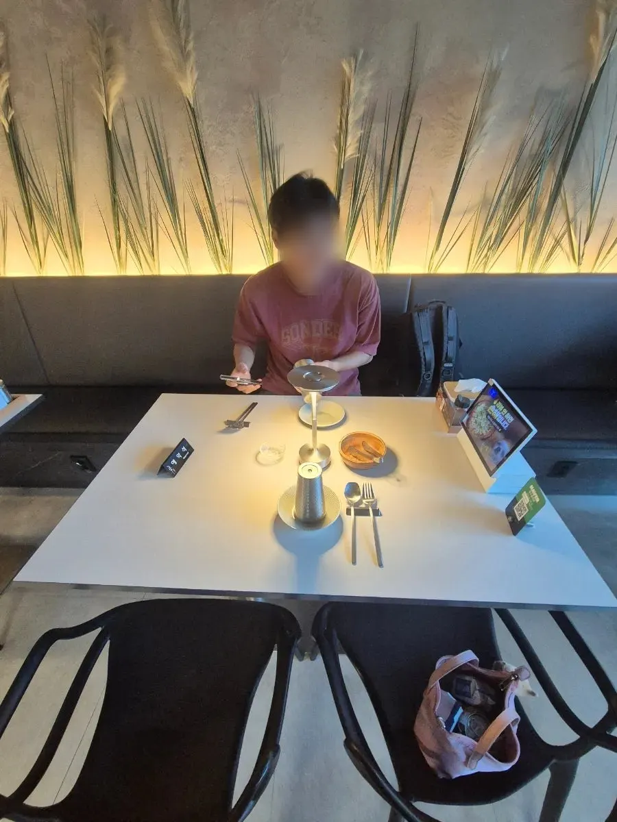 Table setting with water cup, salad bowl, and side plate