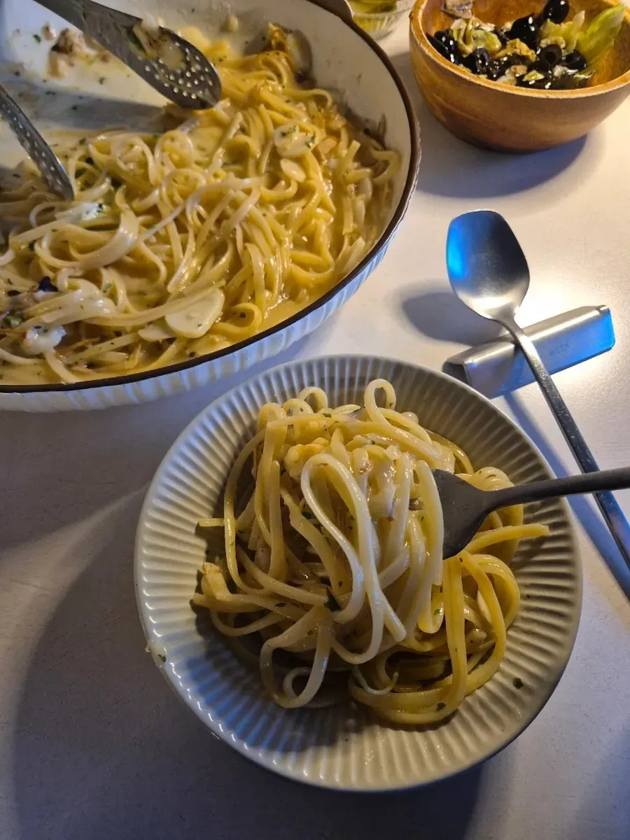Spicy aglio olio pasta served onto a side plate