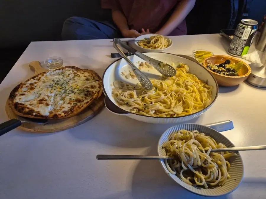 Table with both the pasta and gorgonzola pizza