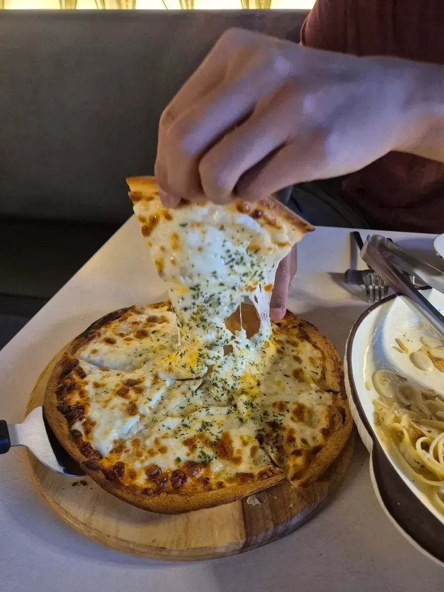 A slice of thin-crust gorgonzola pizza