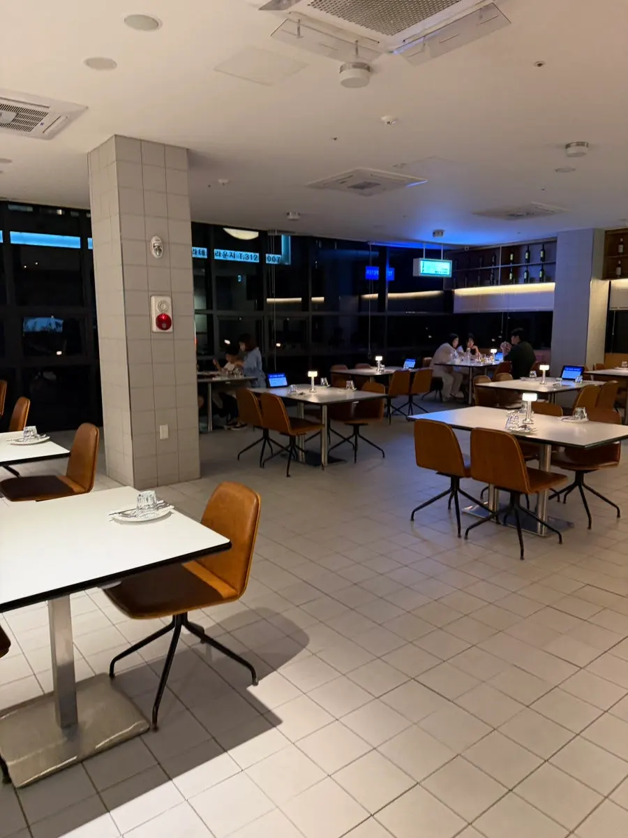 Spacious interior with white and gray tile walls