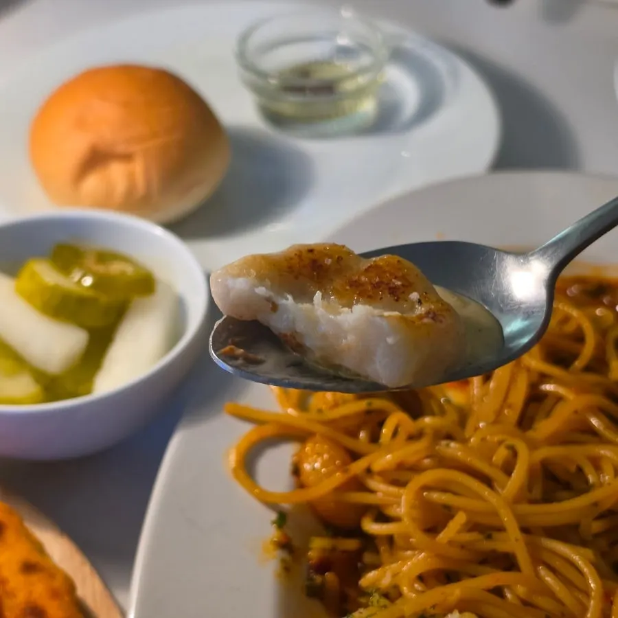 A plate of spicy shrimp oil pasta