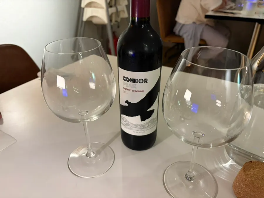 Glass of this month's wine with the table setting