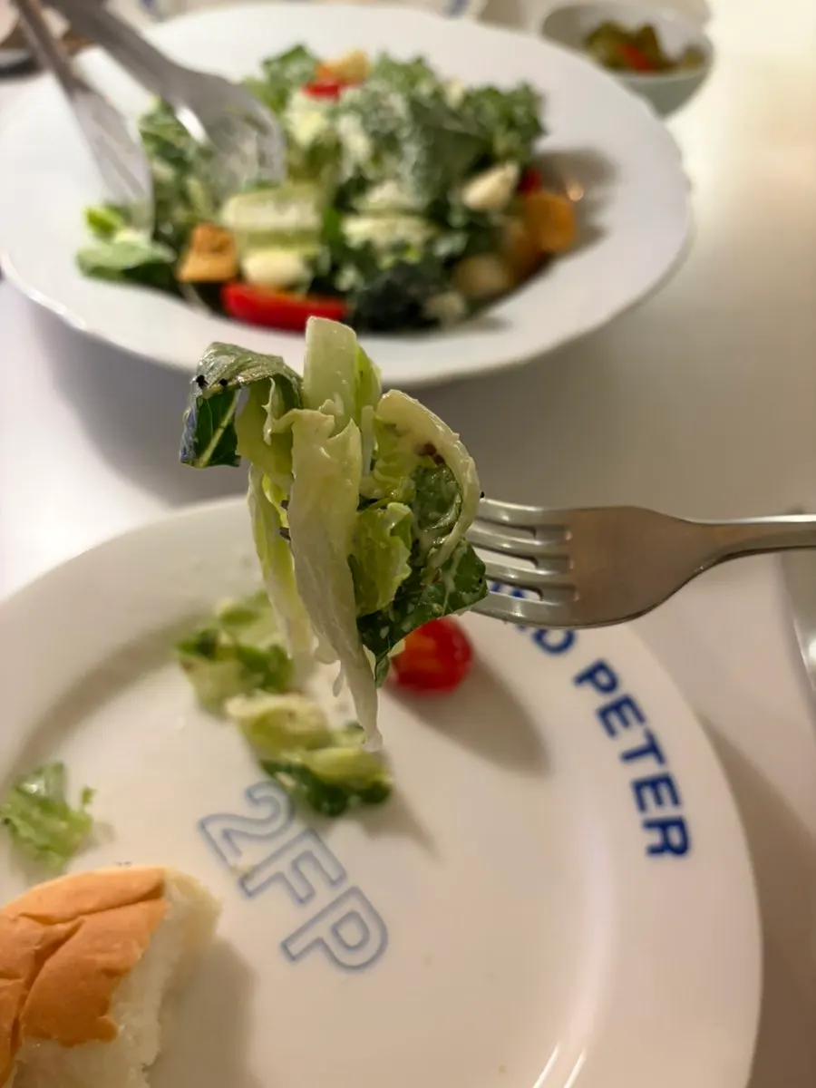 Caesar salad topped with croutons and cherry tomatoes