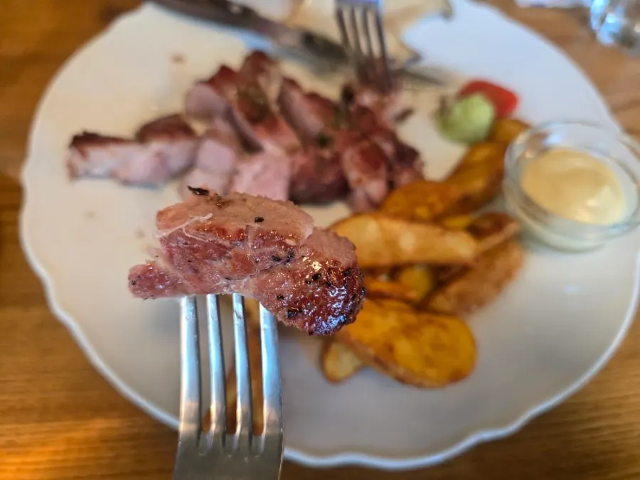 Cross-section of a thick-cut pork collar steak