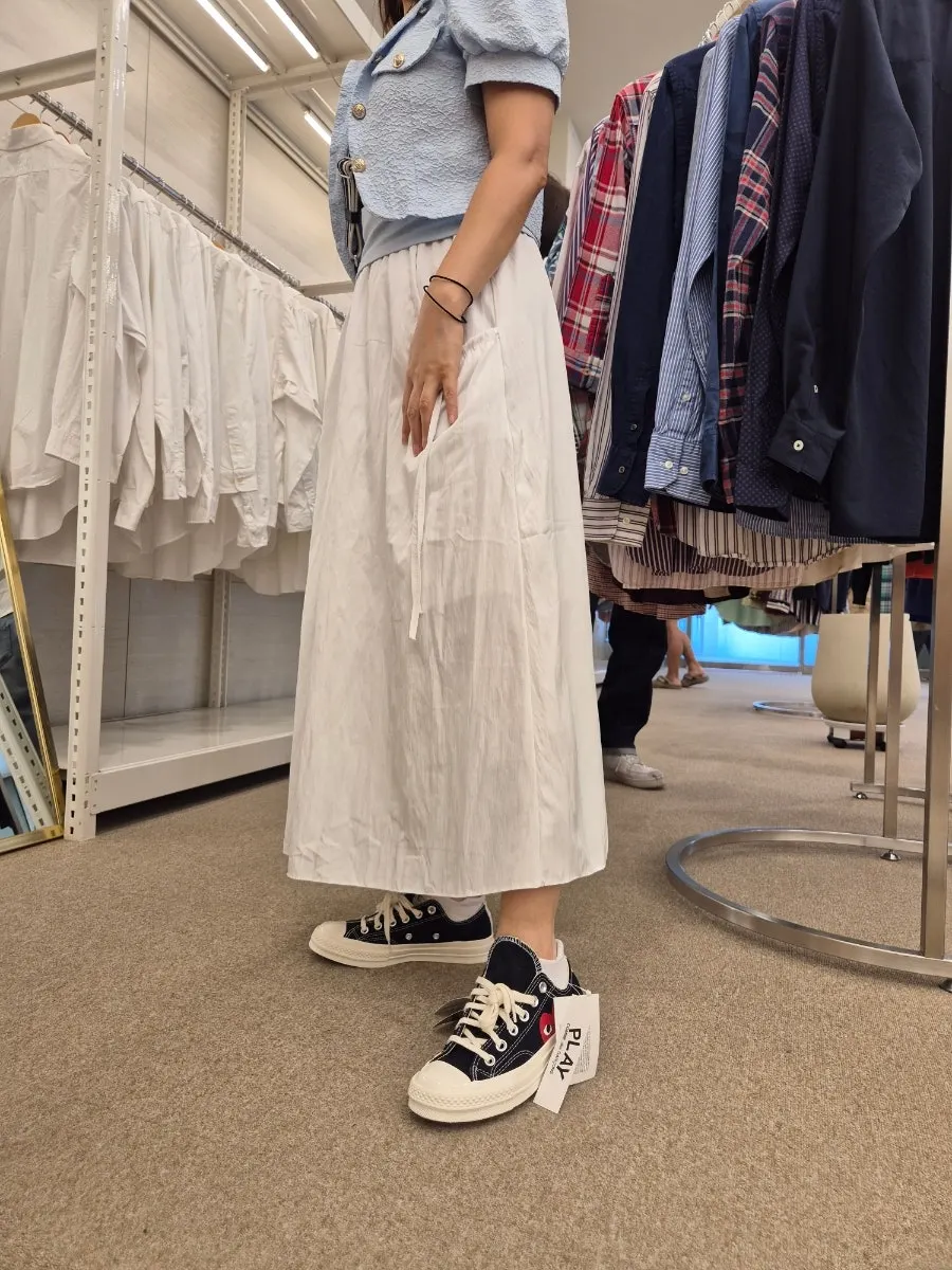 Interior of the vintage clothing store with items displayed by category