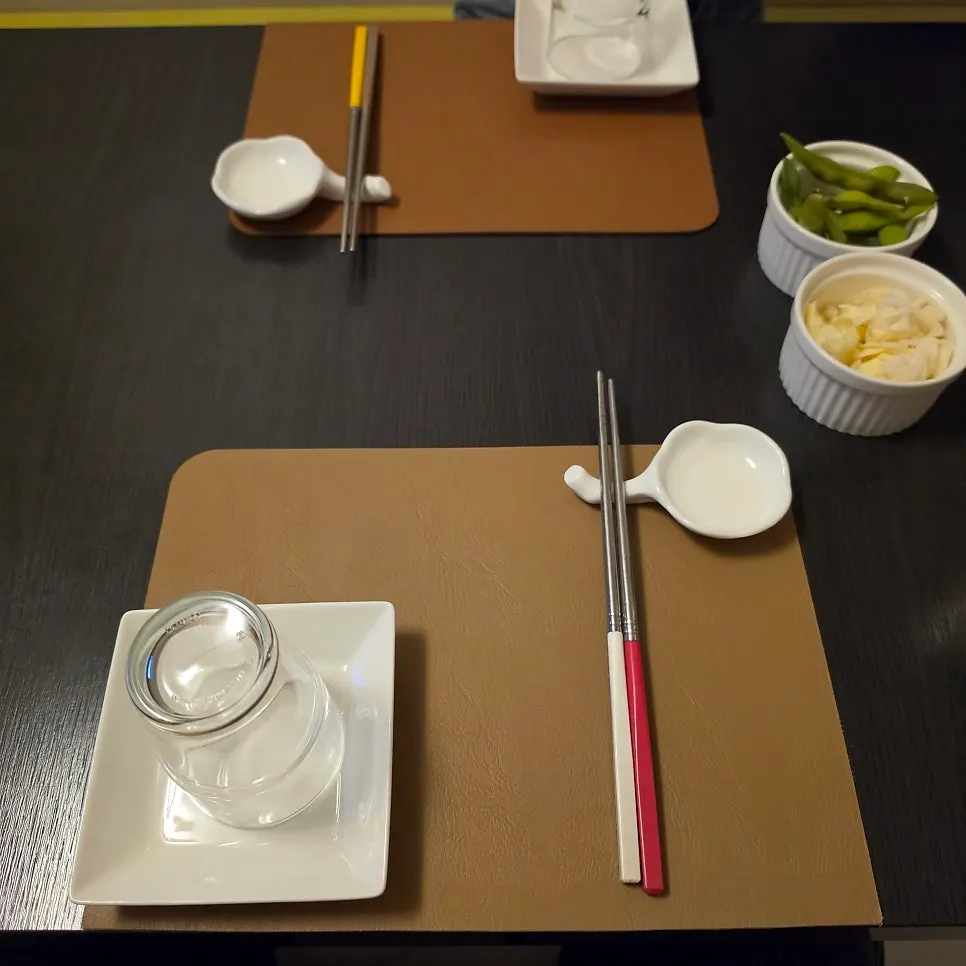 Table with sashimi and side dishes
