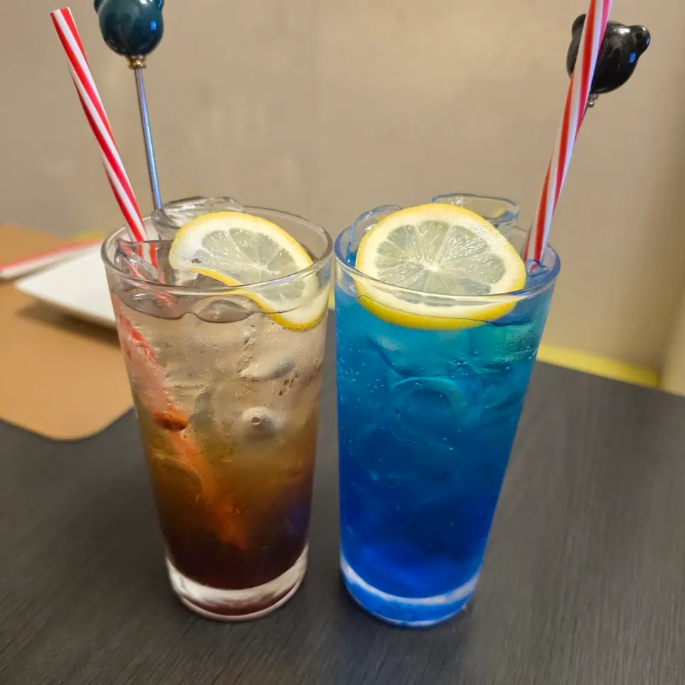 Earl Grey highball and blue lemon highball side by side