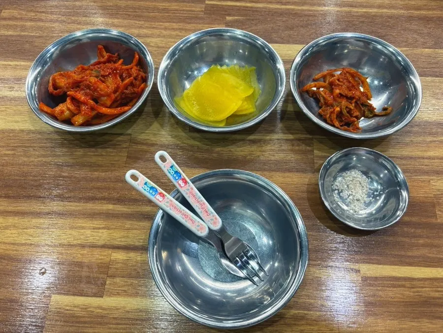 Two plates of spicy and mild kimchi