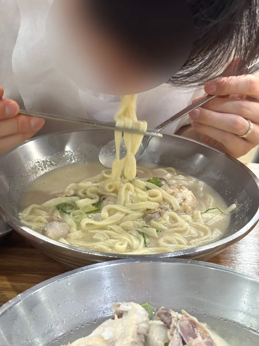 Nearly finished bowls of kalguksu and dakgomtang
