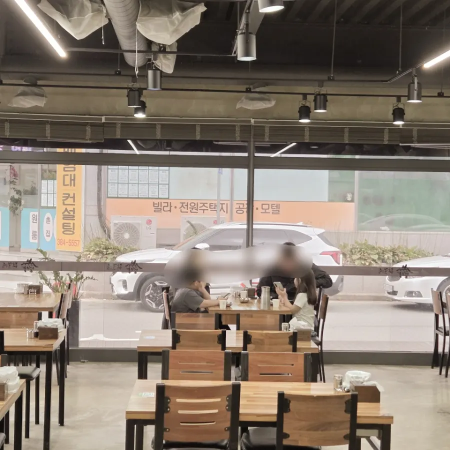 Restaurant interior with floor-to-ceiling windows