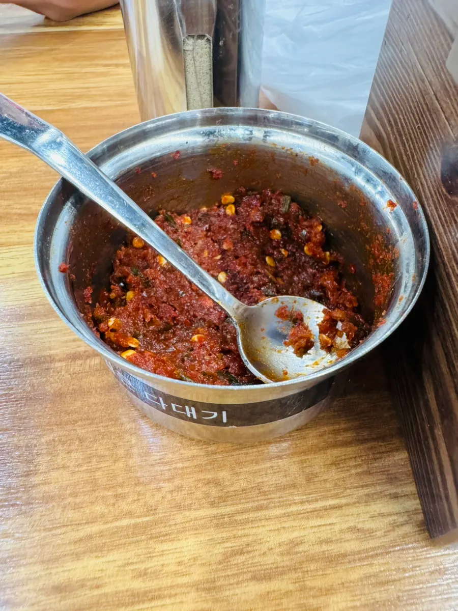 A bowl of rich dak gomtang with rice