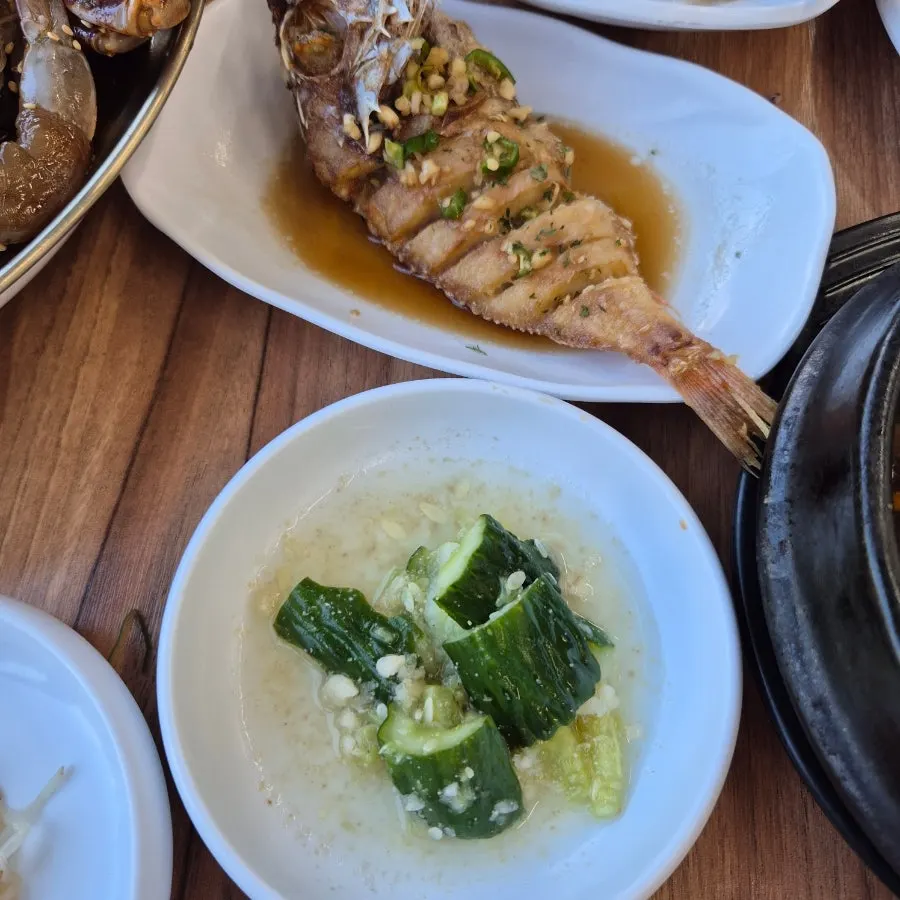 Basic side dishes including seasoned greens and braised kimchi
