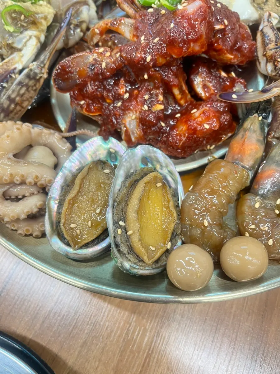 Plate of assorted jang with soy crab, octopus, and abalone