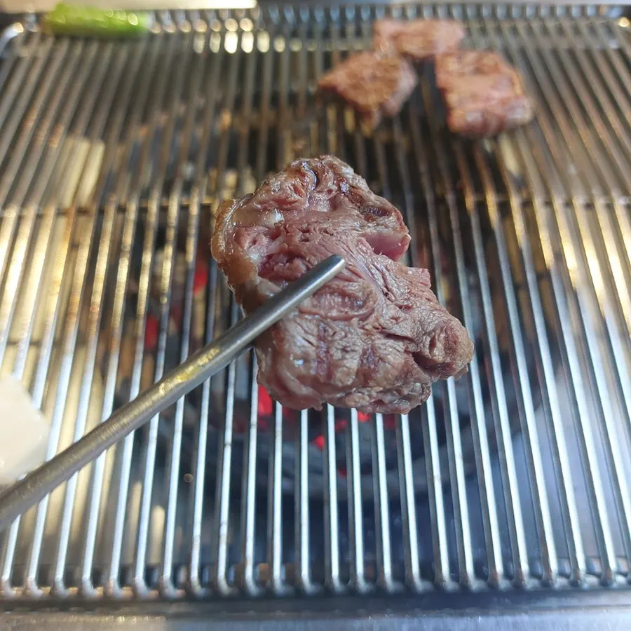 Salchisal being grilled