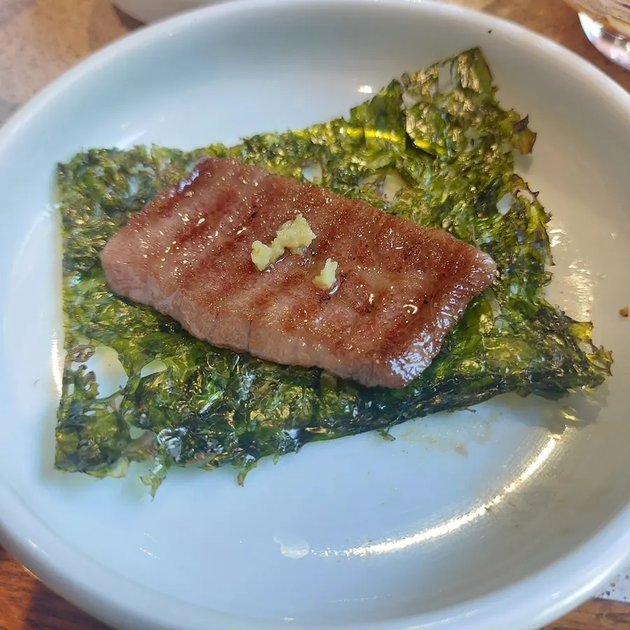 Meat eaten with a ssamjang and wasabi combination