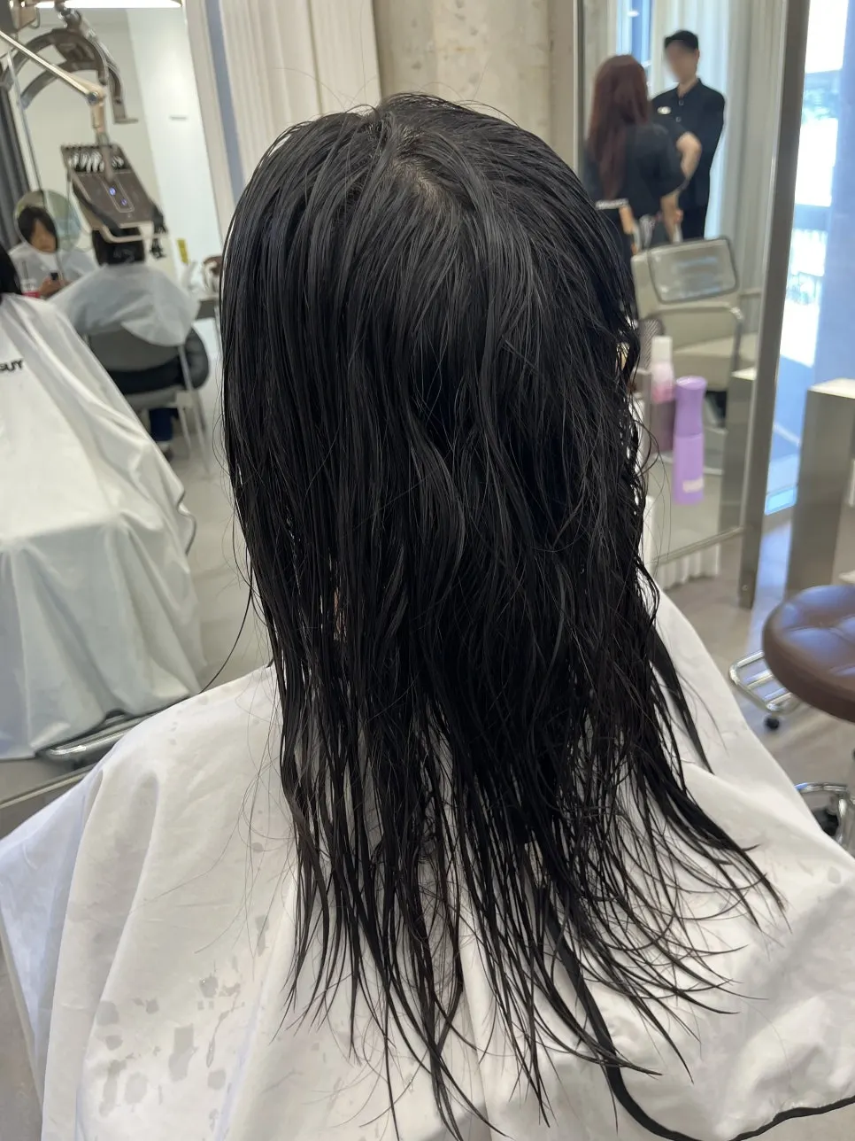Frizzy half-wavy hair before the treatment