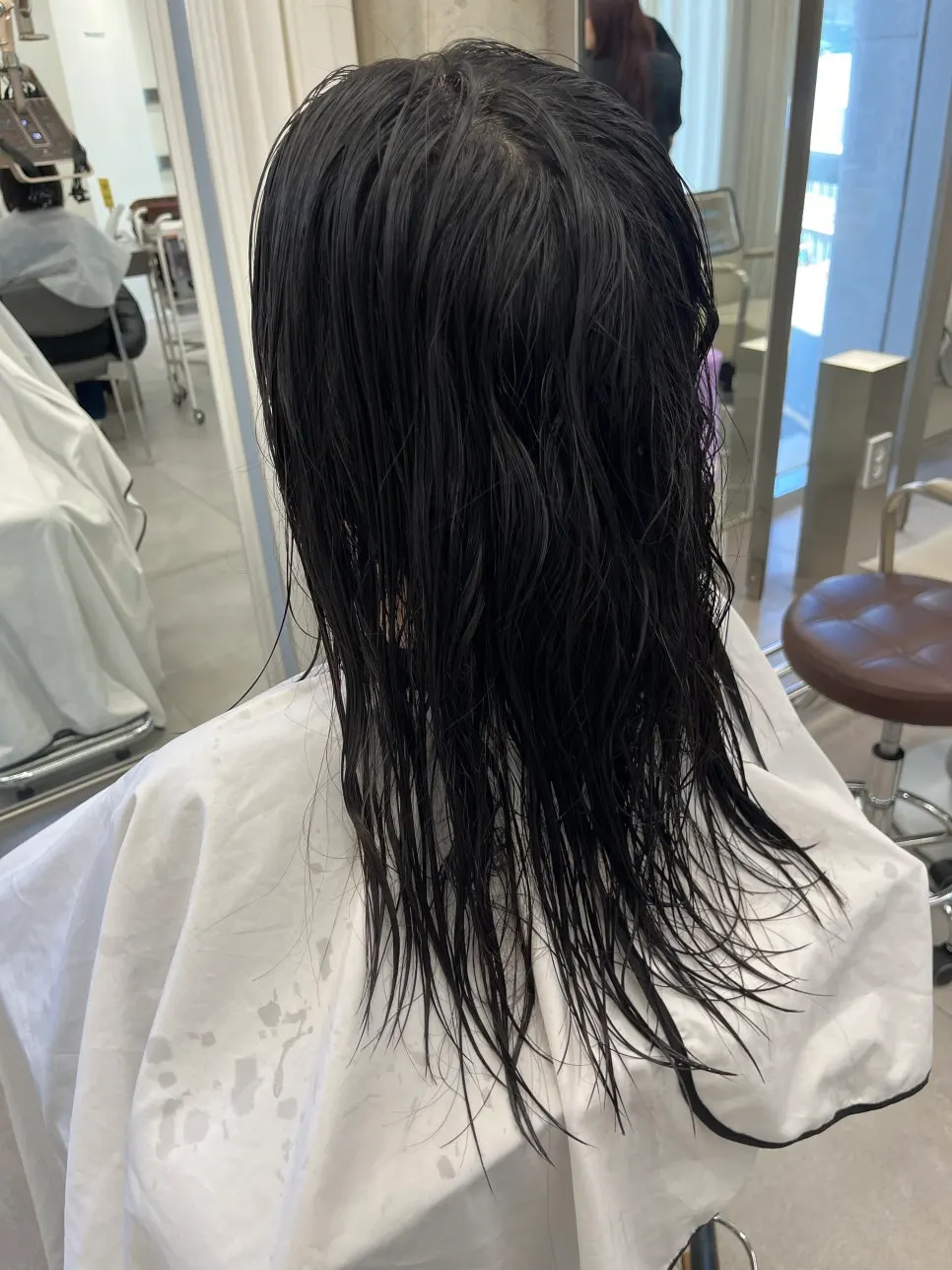 Hair looking messy before the treatment after last year's straightening
