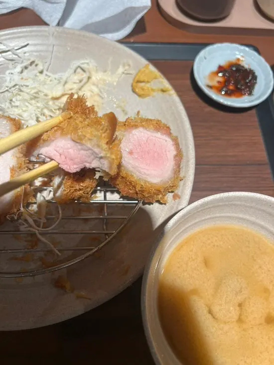 A pale-colored piece of tenderloin katsu