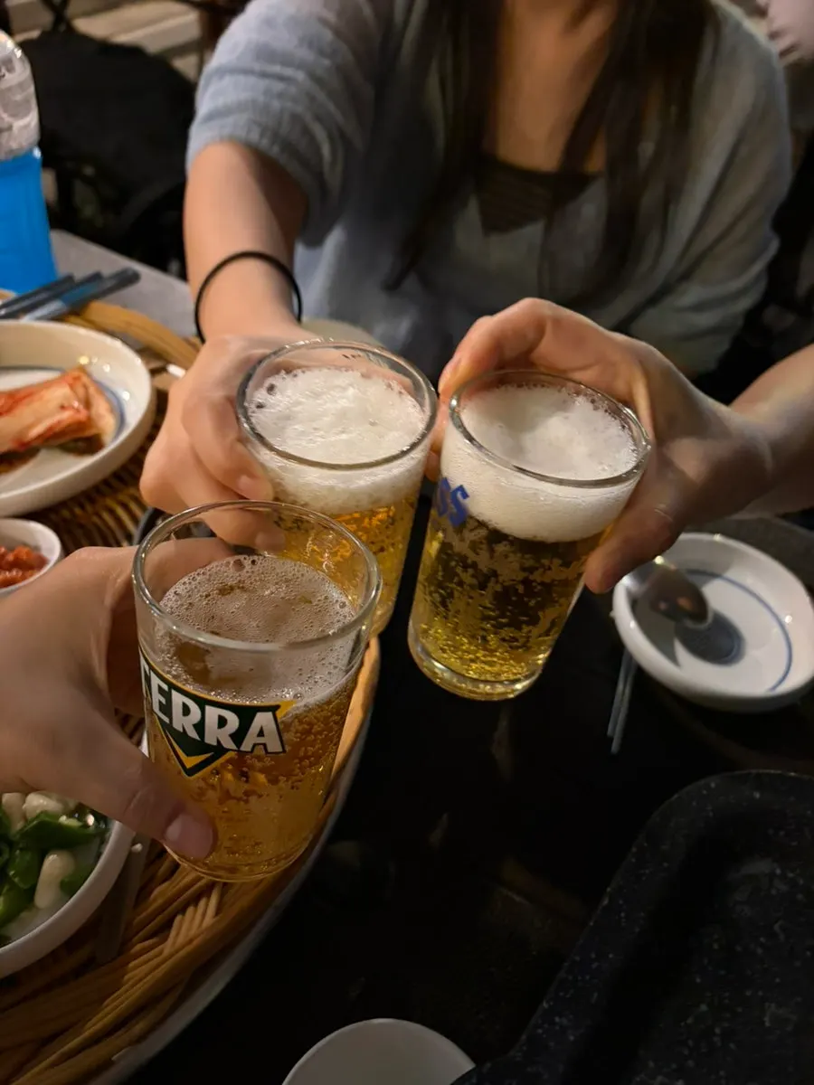 A glass of beer set on the outdoor table