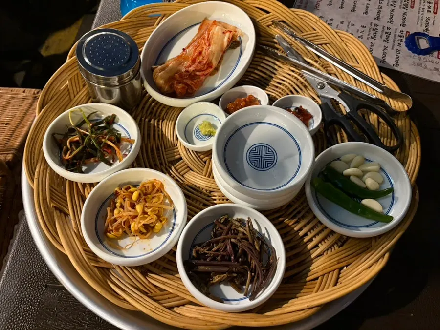 A spread of basic side dishes including kimchi and bean sprouts at Tapgol Gongwon Jongno 3-ga Branch