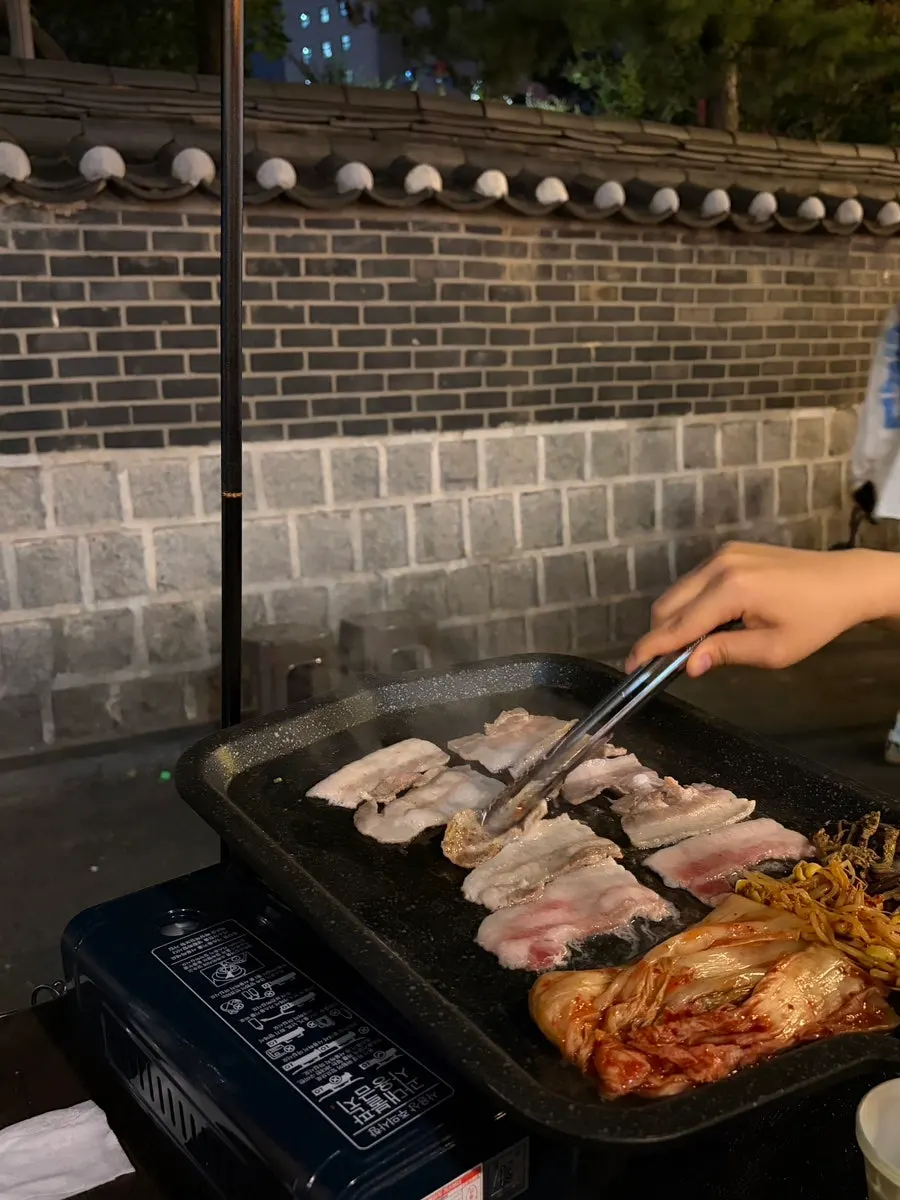 Close-up of grilled pork belly sprinkled with pepper