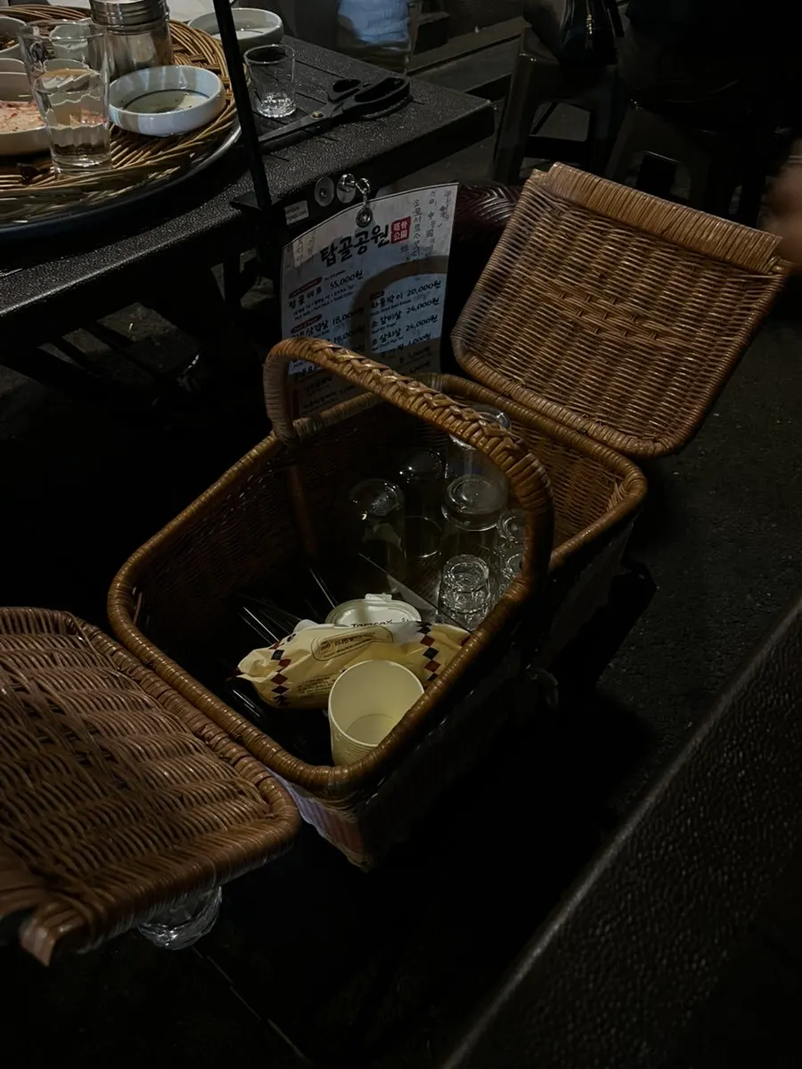 Table basket with utensils and wet wipes